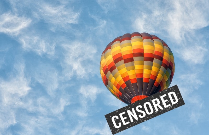 Censored bar over a hot air balloon